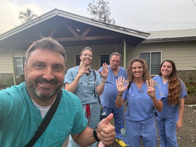 Global Pediatric Specialists Alliance medical team group photo in hospital scrub uniforms.