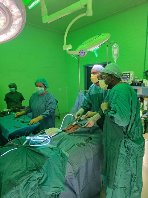 Pediatric surgical team performing a procedure in the operating room.